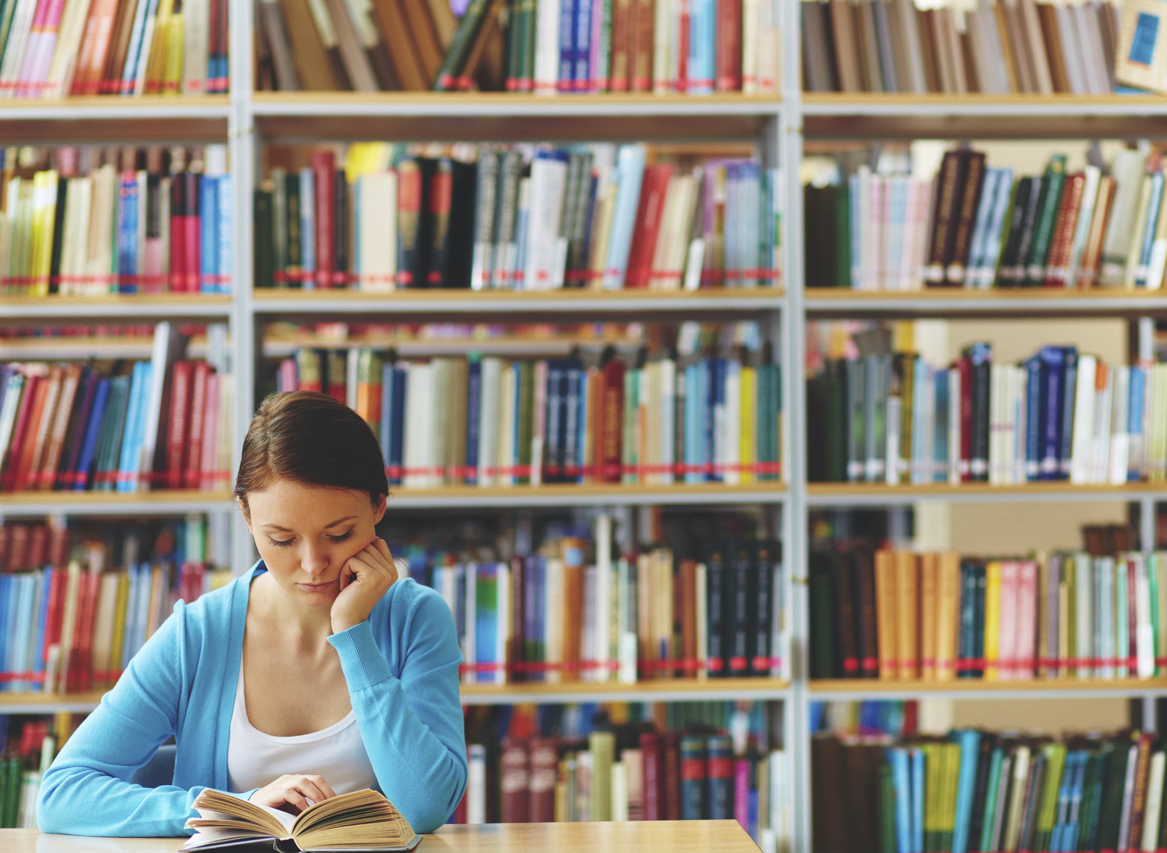 Girl reading in a library